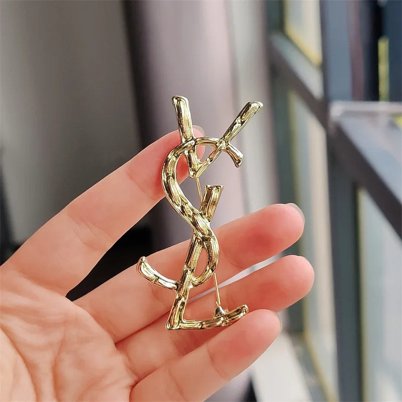 YSL brooch