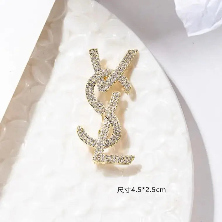 YSL brooch