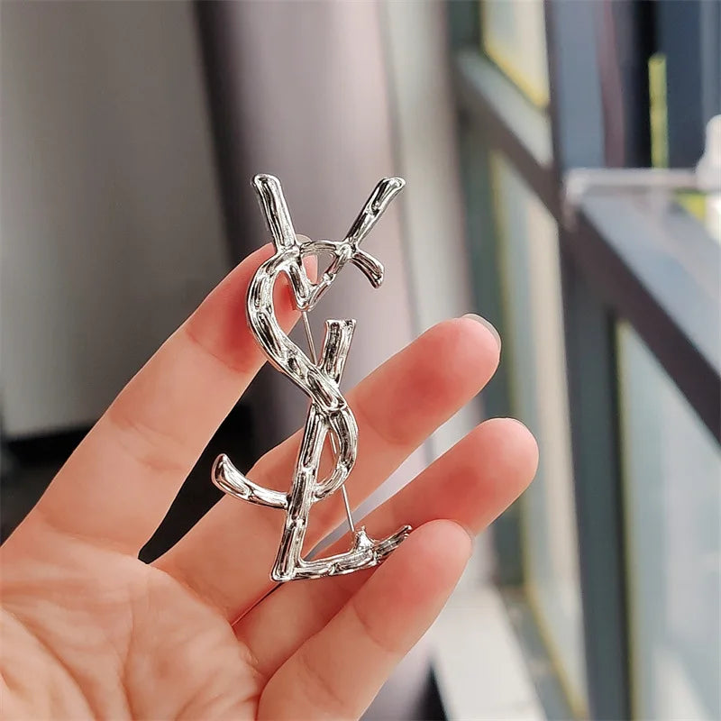 YSL brooch